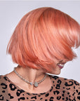 A photo of a model wearing Splat Peachy Coral Hair Dye