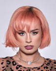 A photo of a model wearing Splat Peachy Coral Hair Dye