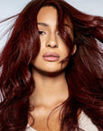 A photo of a model wearing Plum Siren Hair Dye
