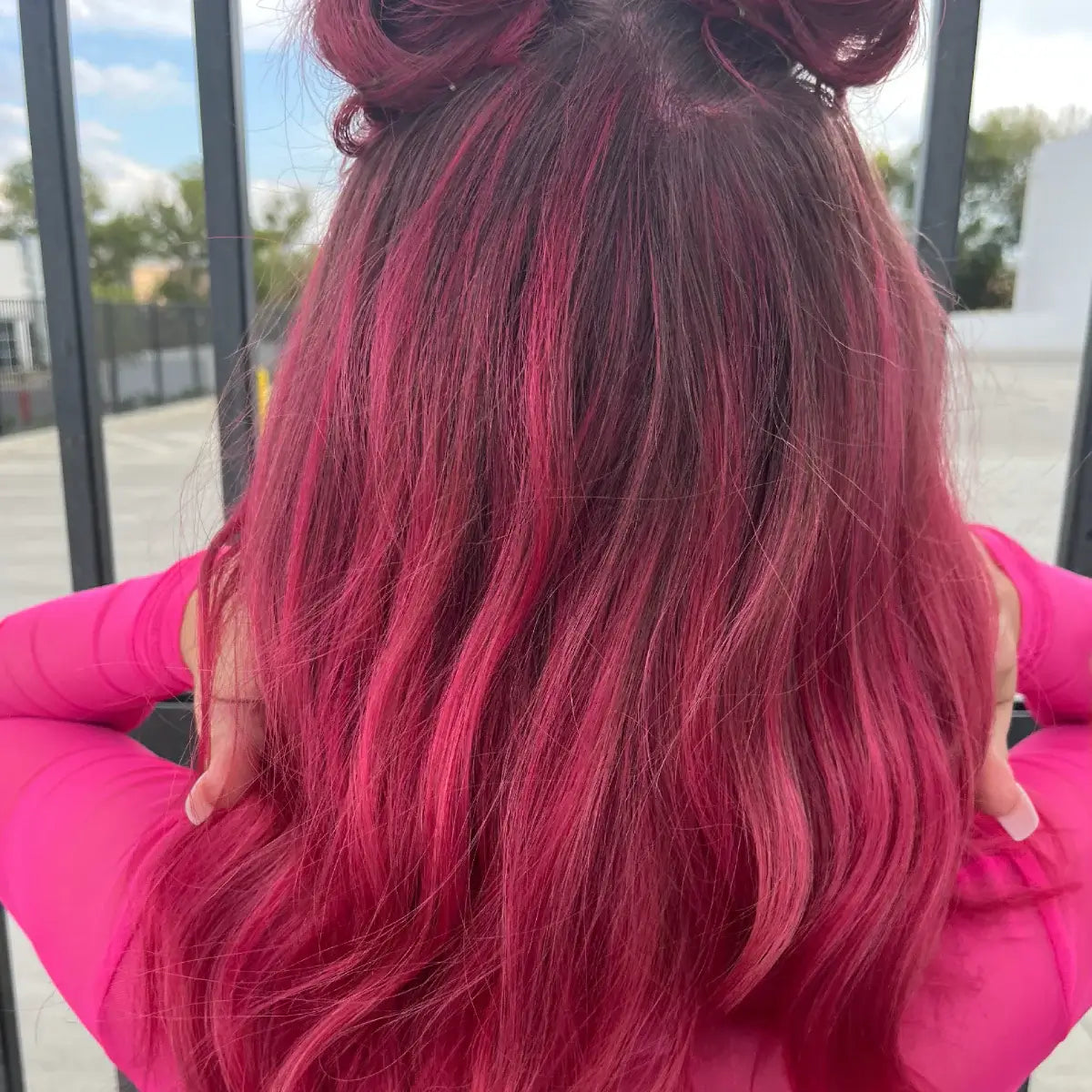 A photo of a model wearing Splat Hair Color's Wild Watermelon Hair Dye